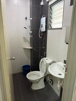 a bathroom with a toilet and a sink at AzzaleaHomes 7 Cameron Highlands in Brinchang
