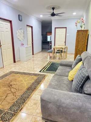 a living room with a couch and a table at Mk homestay butterworth in Butterworth