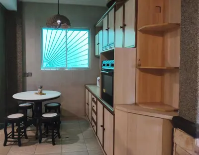 a small kitchen with a table and a window at Untaian Kaseh Villa at Tambun by S&S Groups Consultant in Ipoh