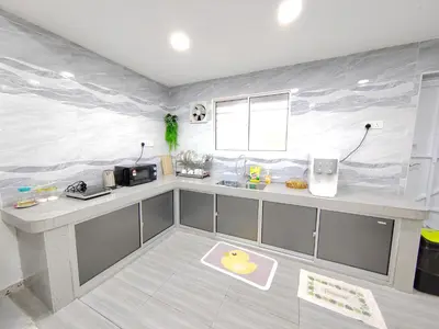 a kitchen with a plastic wall with a rubber duck on it at Ipoh Garden Sunway Guesthouse in Ipoh