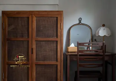 a wooden door next to a desk and a mirror at Lumut Heritage - a walk to Armenian St Art & Cafes in George Town