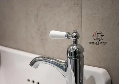 a bathroom sink with a soap dispenser on it at Lumut Heritage - a walk to Armenian St Art & Cafes in George Town