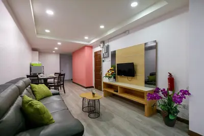 a living room with a couch and a dining room at Gaia Realty Homestay, Private & Convenient Stay in Georgetown in George Town