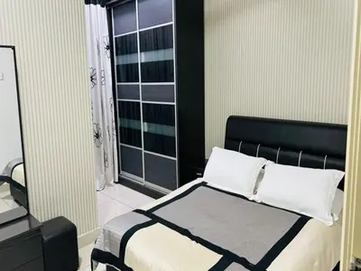 a bedroom with a bed and a window at Residensi Seri Pauh in Bukit Mertajam