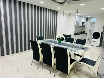 a dining room with a table and chairs at Residensi Seri Pauh in Bukit Mertajam