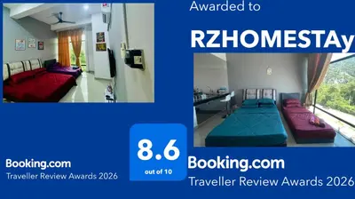 a picture of a room with two beds at RZHOMESTAy in Gua Musang