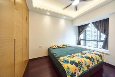 a bedroom with a bed and a window at Princess Cove R&F Luxury apartment with 3 rooms and 2 bathrooms, for 4-6 people, close to the checkpoint, less than 5 minutes away in Gua Sai