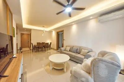 a living room with a couch and a ceiling fan at Princess Cove R&F Luxury apartment with 3 rooms and 2 bathrooms, for 4-6 people, close to the checkpoint, less than 5 minutes away in Gua Sai