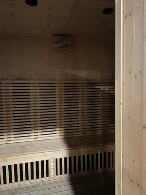 a wooden wall with wooden blinds on a porch at Sunway Onsen 4-6pax in Kampong Batu Lapan