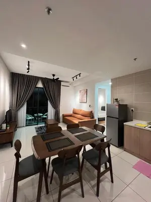 a kitchen and living room with a table and chairs at Sunway Onsen 4-6pax in Kampong Batu Lapan