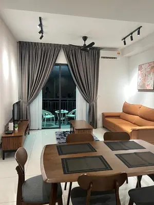 a living room with a couch and a table at Sunway Onsen 4-6pax in Kampong Batu Lapan