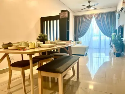 a living room with a table and chairs and a couch at Ipoh Town Majestic Rena 3R2B 10pax Free 2 carpark in Ipoh
