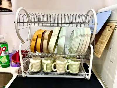 a dish drying rack in a refrigerator with dishes at Ipoh Town Majestic Rena 3R2B 10pax Free 2 carpark in Ipoh