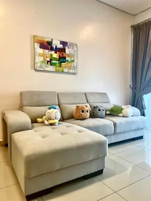 a living room with a couch with stuffed animals on it at Ipoh Town Majestic Rena 3R2B 10pax Free 2 carpark in Ipoh