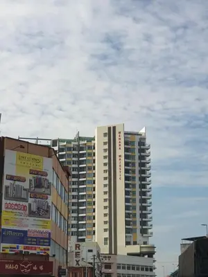 a tall building in the middle of a city at Ipoh Town Majestic Rena 3R2B 10pax Free 2 carpark in Ipoh