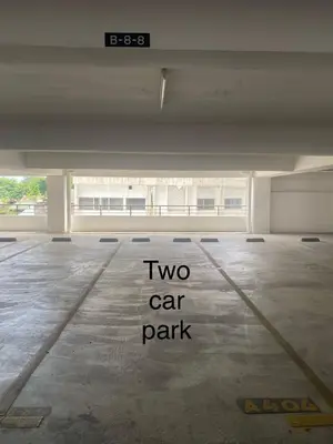 a two car park sign on the floor of an empty parking lot at Ipoh Town Majestic Rena 3R2B 10pax Free 2 carpark in Ipoh