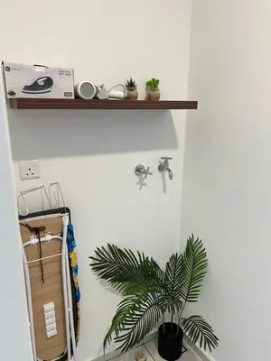 a plant sitting on a wall next to a shelf at Sunway Onsen Cozy view 4-6pax in Kampong Batu Lapan