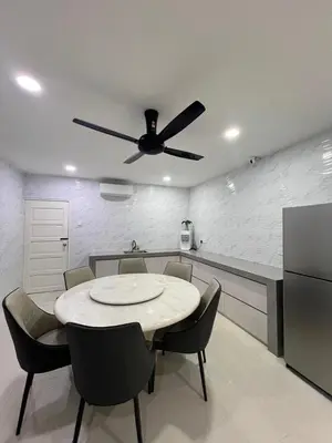 a dining room with a table and a ceiling fan at BungalowD Pool Villa 7R6B with Netflix Enjoyable Movies & Dramas in Ipoh