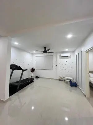a living room with a ceiling fan and a treadmill at BungalowD Pool Villa 7R6B with Netflix Great Movies & Dramas in Ipoh