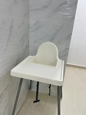 a white chair sitting in a room with a wall at BungalowD Pool Villa 7R6B with Netflix Great Movies & Dramas in Ipoh