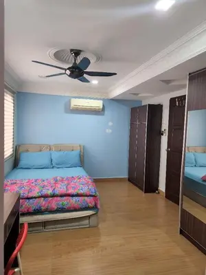 a bedroom with a bed and a ceiling fan at Kinrara HomeStay right at the Heart of Puchong in Gua Sai