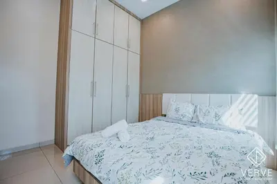 a bedroom with a large bed with white cabinets at Ipoh VastBlue Escape Pool Villa 6B6B 23Pax in Ipoh