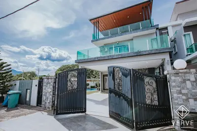 a gate in front of a house at Ipoh VastBlue Escape Pool Villa 6B6B 23Pax in Ipoh