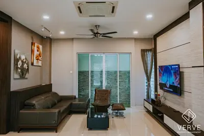 a living room with a couch and a tv at Ipoh VastBlue Escape Pool Villa 6B6B 23Pax in Ipoh