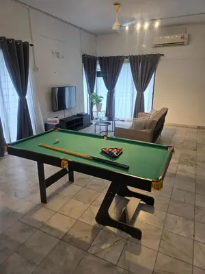 a living room with a pool table in it at PJ Homestay in Bayan Lepas