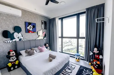a bedroom with a bed with stuffed animals on it at Breezy Urban 6pax SeaView InfinityPool Georgetown in George Town