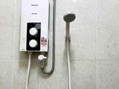 a phone on a wall in a bathroom at \u60a6\u5ba2YK Homestay 5mins to IconCity in Bukit Mertajam