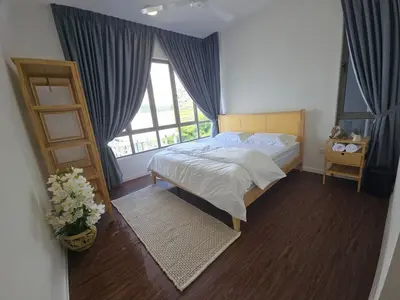 a bedroom with a bed and a large window at Kea Farm Stay in Brinchang