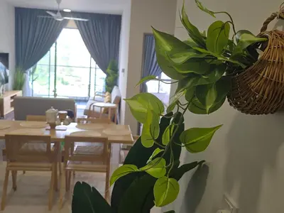a living room with a plant on the wall at Kea Farm Stay in Brinchang