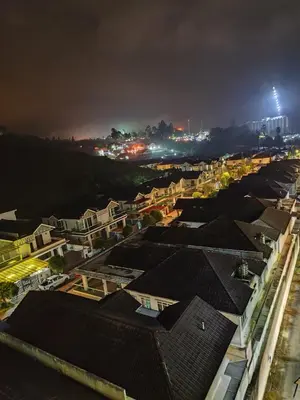 a view of a city at night with buildings at Bukit Urbane Night Market CH in Brinchang