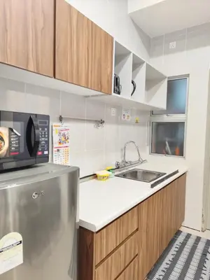 a kitchen with a sink and a microwave at Bukit Urbane Night Market CH in Brinchang