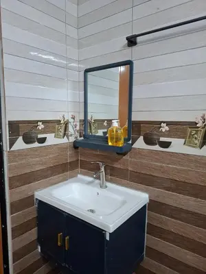 a bathroom with a sink and a mirror at Family Homestay Bidor in Gua Sai