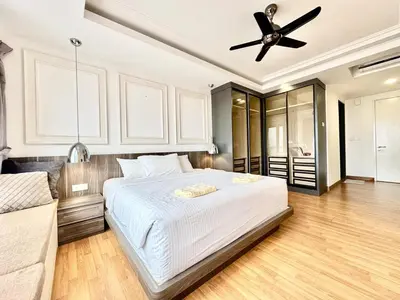a bedroom with a bed and a ceiling fan at Tropicana 218 Macalister #LuxuryFrenchVintage #InfinityPool #Studio2pax #Quality well maintained #Private host in George Town