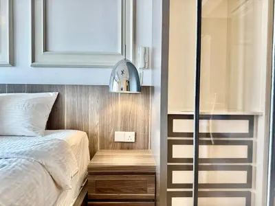 a bedroom with a bed and a window and a mirror at Tropicana 218 Macalister #LuxuryFrenchVintage #InfinityPool #Studio2pax #Quality well maintained #Private host in George Town