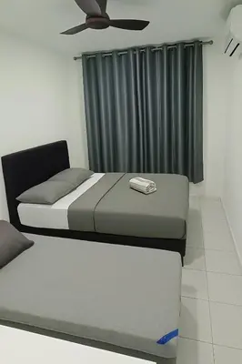 a bedroom with two beds and a ceiling fan at Ipoh Homestay at Anderson - 2 Room 2 Bathroom -Maximum 6 pax --Self Check In-- in Ipoh