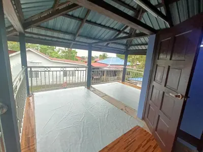 a view from the inside of a screened in porch at Teratak Taha in Kepala Batas