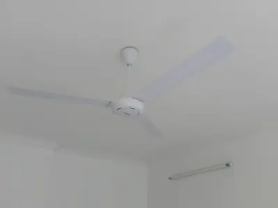 a ceiling fan with a light on a ceiling at Olive home in Ipoh