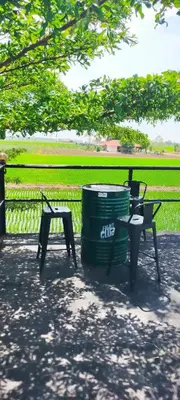 two chairs and a trash can next to a trash can at Casa Studio Roomstay Sekinchan in Sekincan