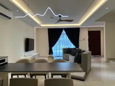 a living room with a table and a couch at Karaoke Cozy Landed Home at Sutera n Paradign for 10pax in Gua Sai