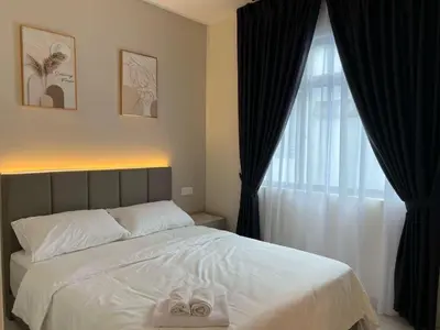 a bedroom with a bed and a window with two slippers at Karaoke Cozy Landed Home at Sutera n Paradign for 10pax in Gua Sai