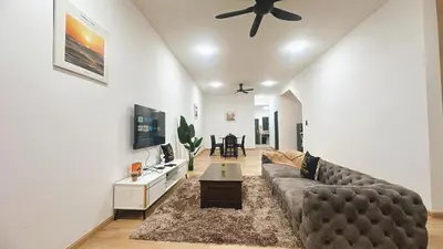 a living room with a couch and a flat screen tv at A29 Ella Dato Onn 23 Max 10 People in Gua Sai
