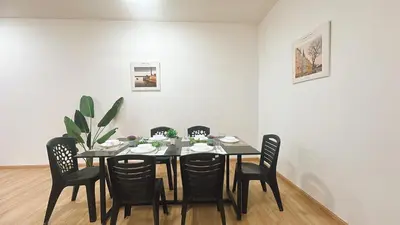 a black dining room table with chairs and a plant at A29 Ella Dato Onn 23 Max 10 People in Gua Sai