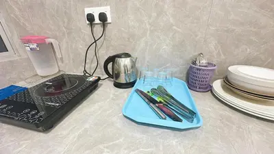 a table with a tray of utensils on a counter at A29 Ella Dato Onn 23 Max 10 People in Gua Sai