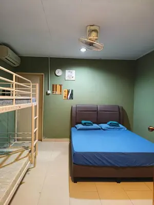 a bedroom with a bed and a bunk bed at Ulu River Lodge, Riverbug Perak in Gopeng