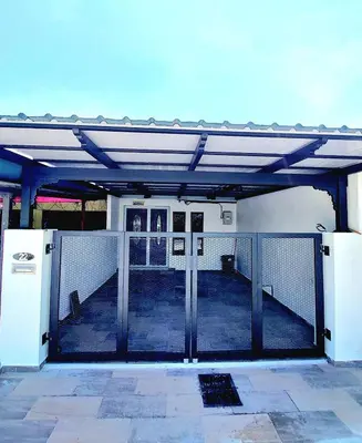 an open gate to a building with a fence at The Minimalist Stay Station 18 in Ipoh