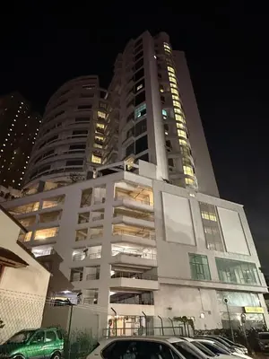a tall building with cars parked in front of it at THE CEO 3 BEDROOM near USM SPICE ARENA PANTAI SPECIALIST AIRPORT in Bayan Lepas